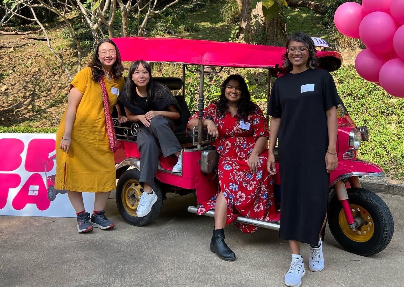 Colleagues from the Kontinentalist news site, based in Singapore, pose on a tuktuk. Co-founder Pei Ying Loh is on far left; Editorial lead Nabilah Said is on the far right.